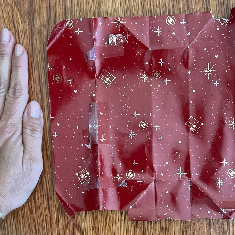 CHANEL Red Gift Wrap with Festive Patterns